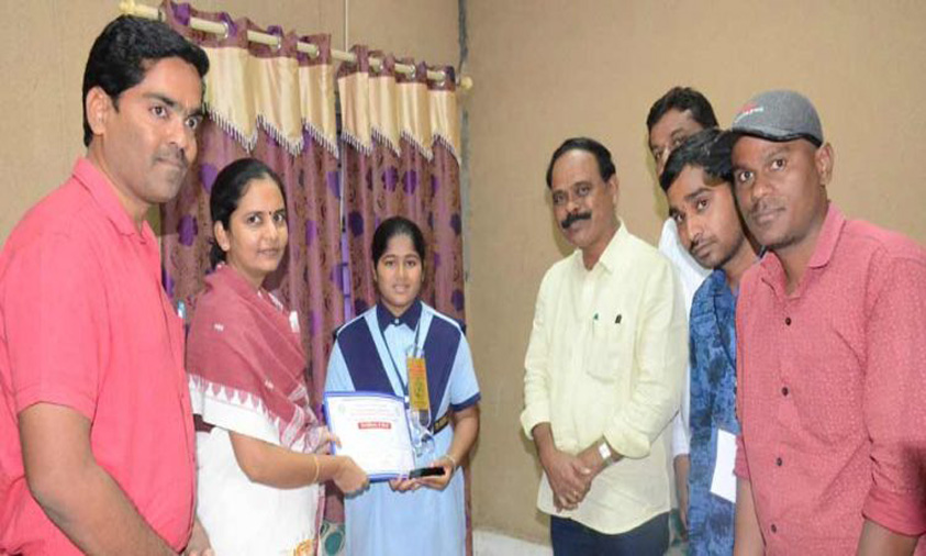 Adilabad Collector felicitates three students