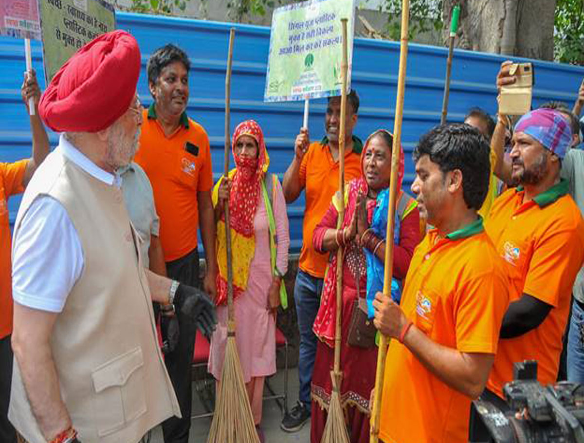 Union Minister Hardeep S Puri leads a cleanliness drive at Copernicus Marg in Delhi