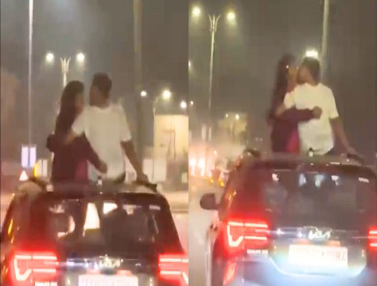 Couple Kissing On The Roof Of A Moving Car in Hyderabad